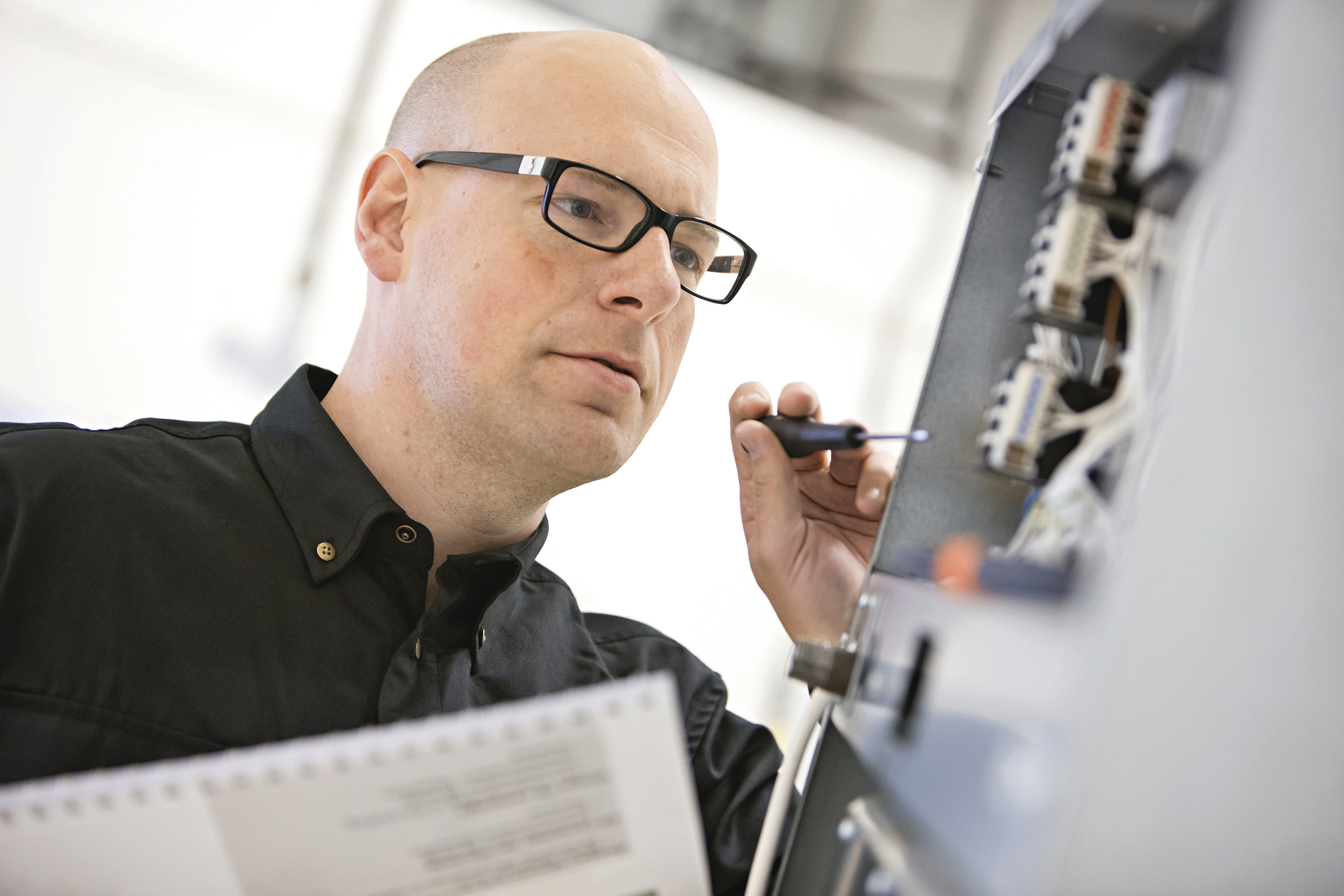 ILS engineer reviewing equipment and the next support step on site